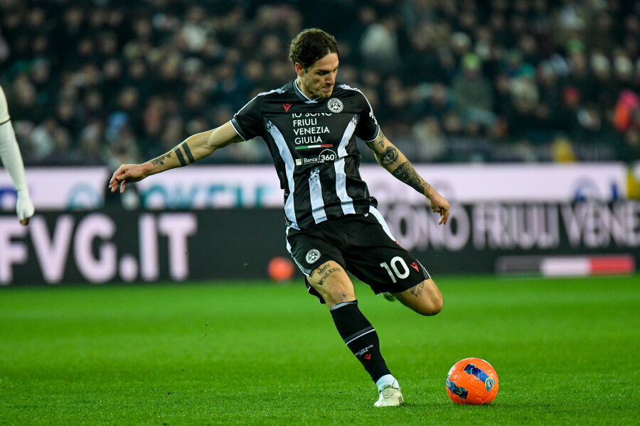 Udinese snatched a point against Lazio in added time.