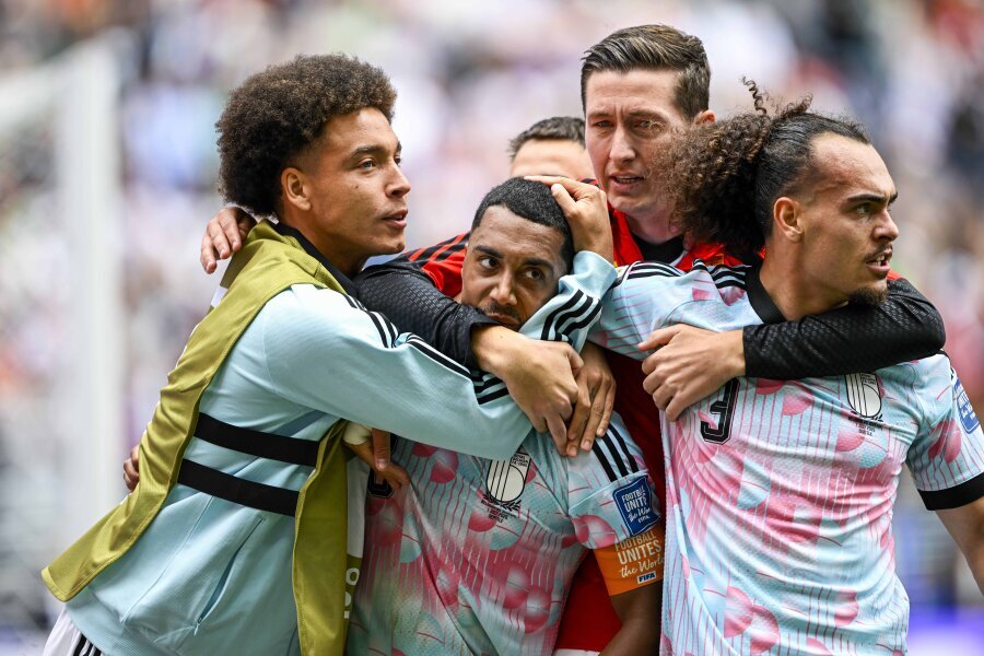 Championship return: Belgians, who miraculously erased a 2-goal deficit, advance to the World Cup Round of 16.