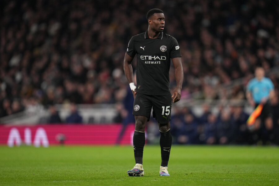 Defenders' goals secured Manchester City's first win of the season.